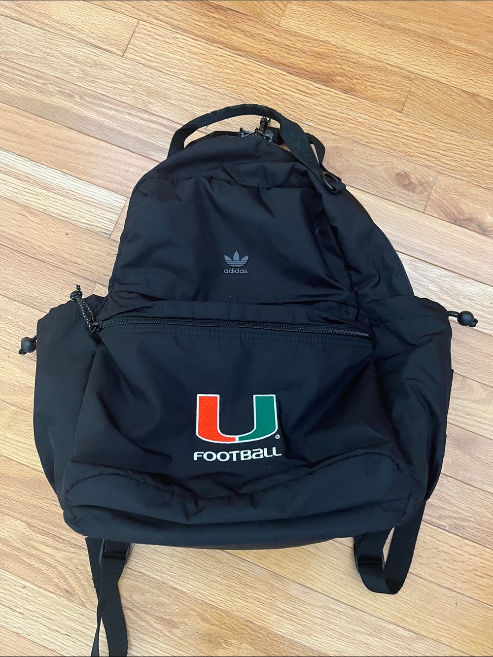 adidas Black Backpack with Orange and Green 'U' Football Logo